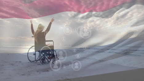 person in wheelchair celebrating on beach with digital connections animation overlay