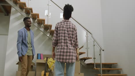 video of happy african american couple embracing after moving into new house