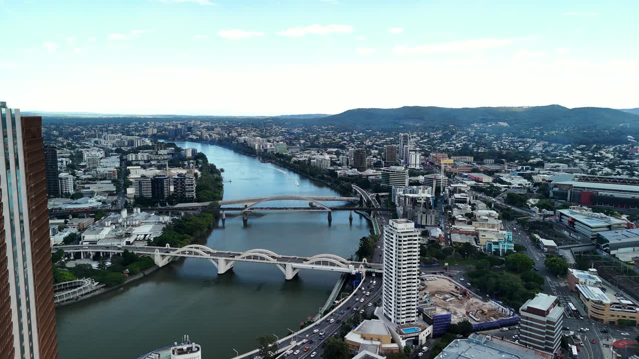 Network of bridges spanning over the Brisbane River connecting surrounding suburbs to the Brisbane City CBD. Aerial view