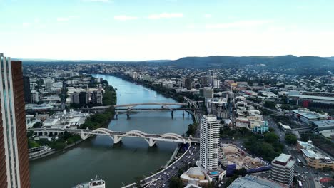 network of bridges spanning over the brisbane river connecting surrounding suburbs to the brisbane city cbd. aerial view