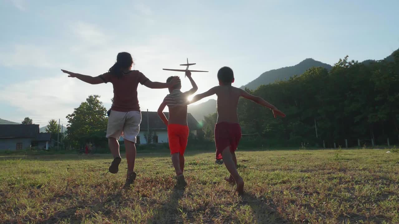 Children Playing with a Toy Airplane
