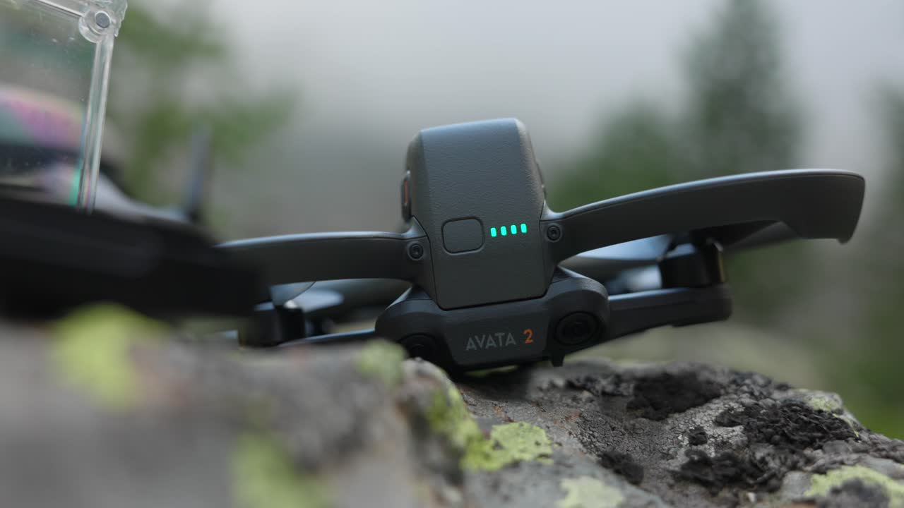 Detail macro closeup of drone DJI Avata turned on while placed on rock outside