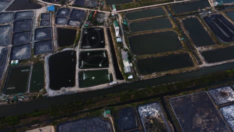 aerial panorama, industrial vietnamese salt mine farm fields along ocean coast