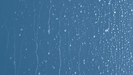 gotas líquidas de agua en una superficie brillante (en bucle)