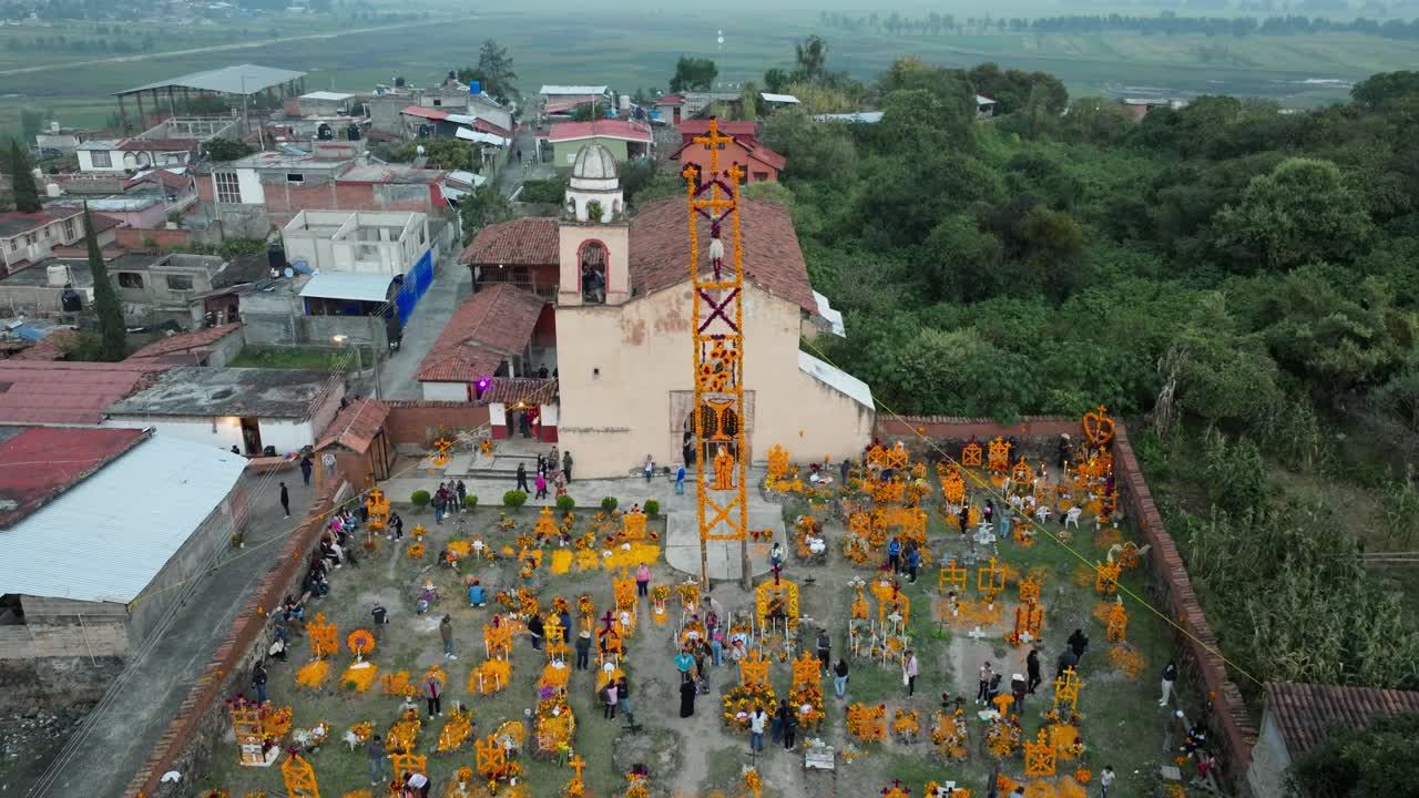 DRONE: REVEAL SHOT OF AROCUTIN GRAVEYARD AND CHURCH AT DAY OF THE DEATH IN PATZCUARO LAKE