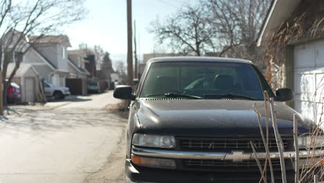 black pickup truck parked in an alley