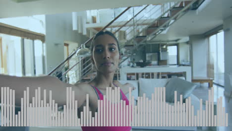 female athlete performing balance exercise in living room, animated fitness chart floating