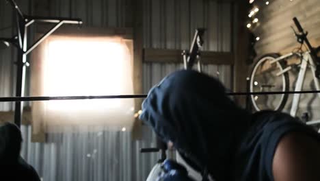 coach and boxer practicing boxing in the gym