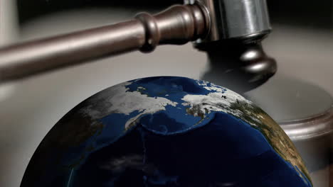 Animation-of-spinning-globe-over-moving-gavel