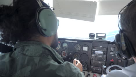 a slow motion shot of a uniformed pilot and copilot