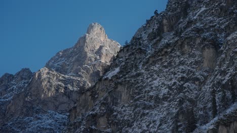 dolomites mountain peaks surrounding lake braies, in the italian alps, in winter