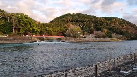 red-Asagiribashi-Bridge-to-Furitsu-Uji-Park-at-Uji,-Kyoto