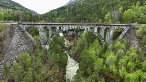 Kylling-bridge-in-Rauma-passing-above-gorge-with-river-Verma---Closeup-detailed-aerial-view