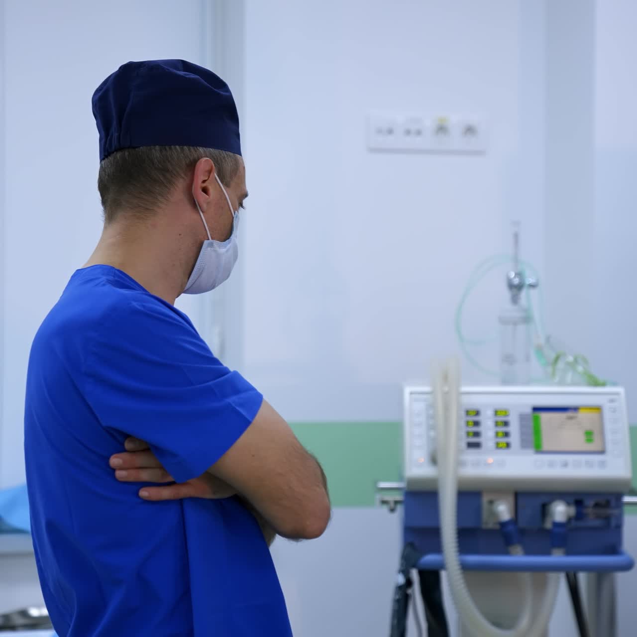 Doctor observes the work of medical equipment. Medical specialist looking at medical accessories in the hospital. Surgical department