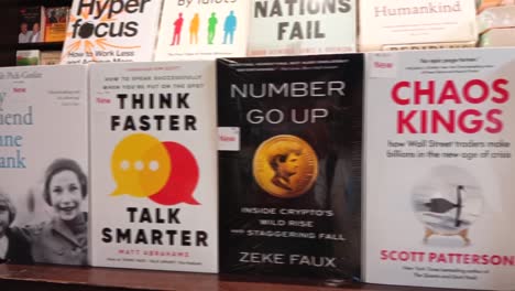 pan shot of books in store. display of books.