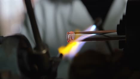 close-up of male worker creating glass in glass factory 4k