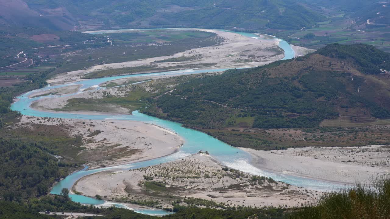 Wild Vjosa River Winding Through Green Hills with Olive Trees and Vineyards in Untouched Albanian Nature