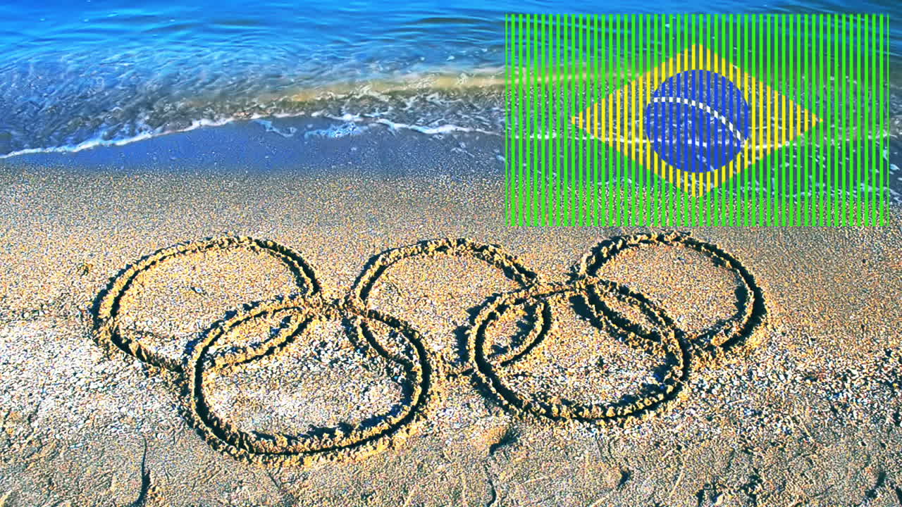 Símbolo de los Juegos Olímpicos en la arena, la playa. Inscripción en la arena