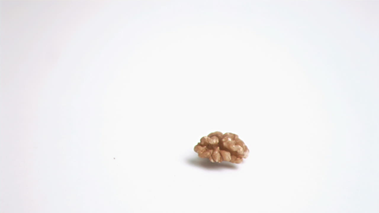Walnut kernel falling in super slow motion