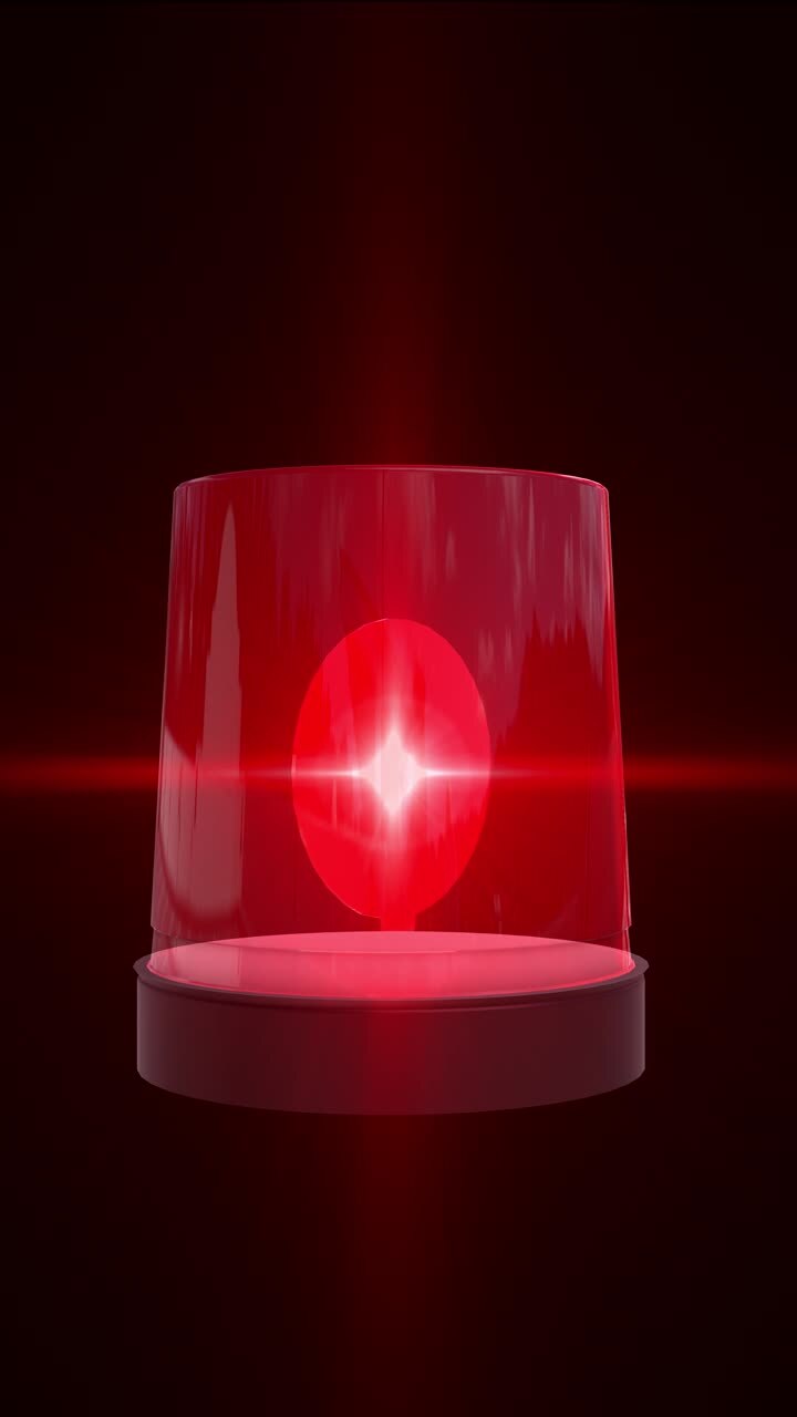Red emergency siren light representing alert signal used for emergency response danger warning
