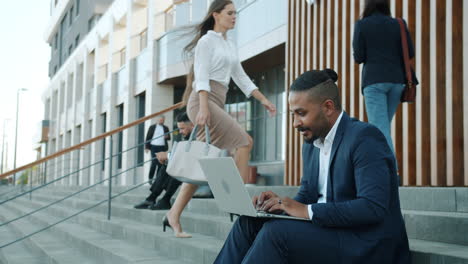 businessman working on a laptop outside
