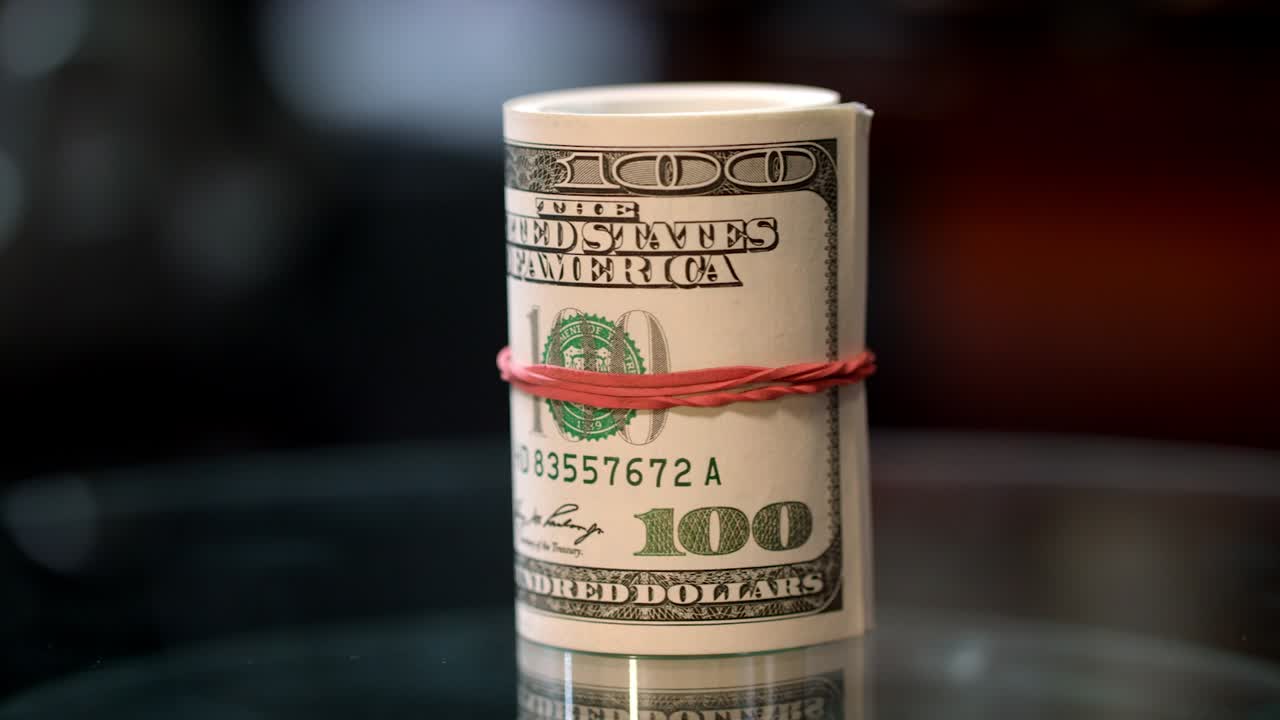 Money roll on table. Credit proposition from bank. Business success