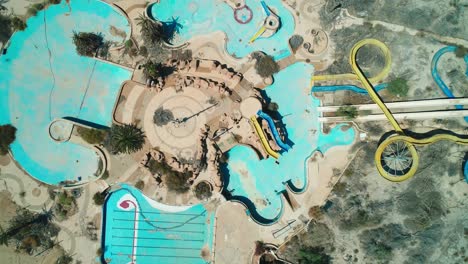 drone shot of an abandoned water park in the desert