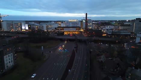 aerial view away fromt the illuminated kupittaa railway station, evening in turku