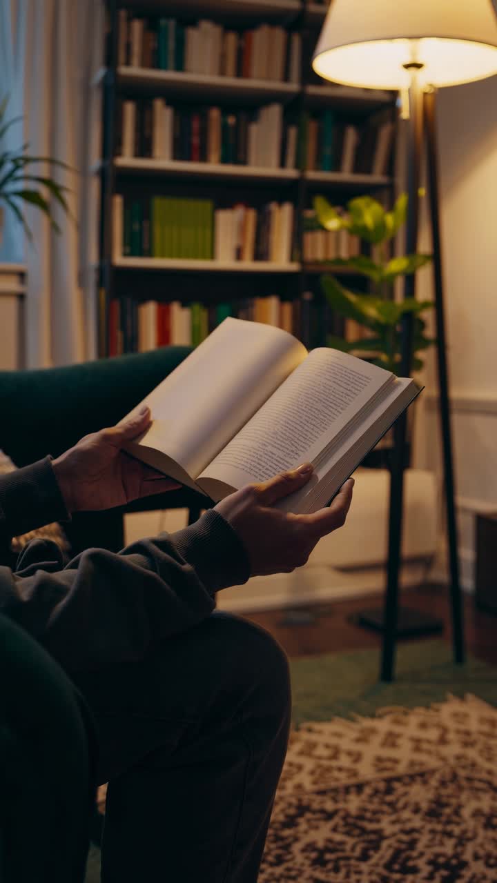Cozy reading nook with warm lighting, captured from a low angle. Perfect for a relaxing video scene