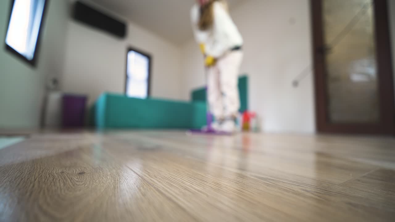 POV home care scene with a woman mopping the floor in a modern interior, emphasizing hygiene and lifestyle