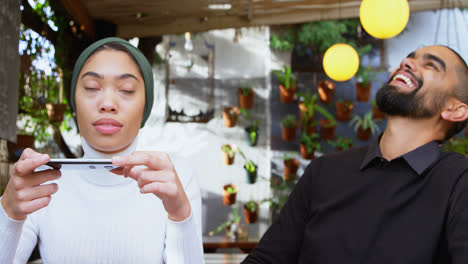 couple taking photo in cafeteria 4k