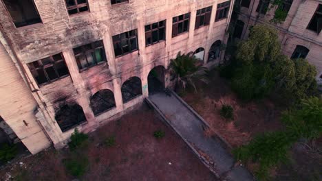 Tilt-up-descent-of-the-abandoned-former-maternity-ward-of-the-Barros-Luco-Hospital---broken-glass-and-gloomy