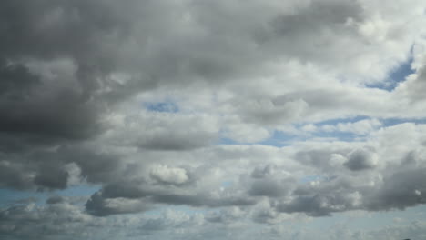 clouds racing across the sky from right to left with darker clouds moving in at the end