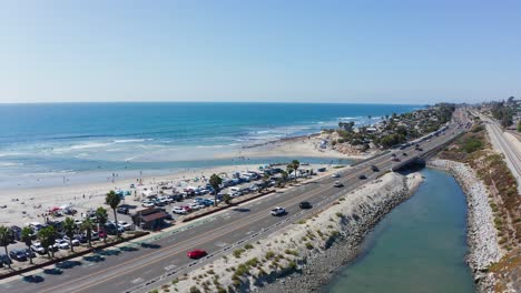 drone shot over cardiff-by-the-sea beach and highway 101 on the west coast of america