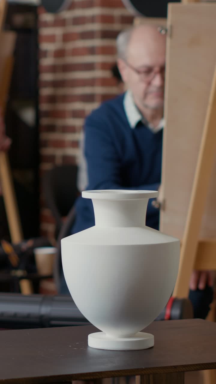 Ceramic Vase on Table with People in Background