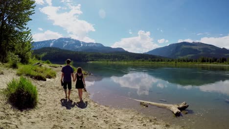 couple walking near lakeside 4k