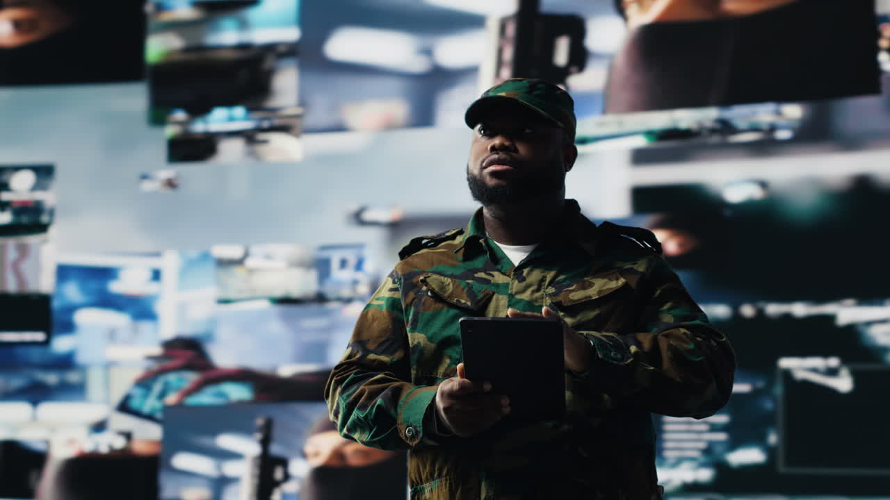 Black veteran reviewing battlefield data in a high tech command center