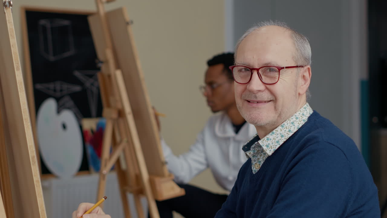 Portrait of senior man using pencil to learn drawing skills