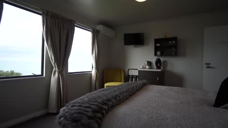 luxury modern boutiqe hotel room double queensize bed with lamps, ocean sea view