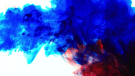 ink cloud overlay. color blast. blue , red smoke motion on white background for video editing.