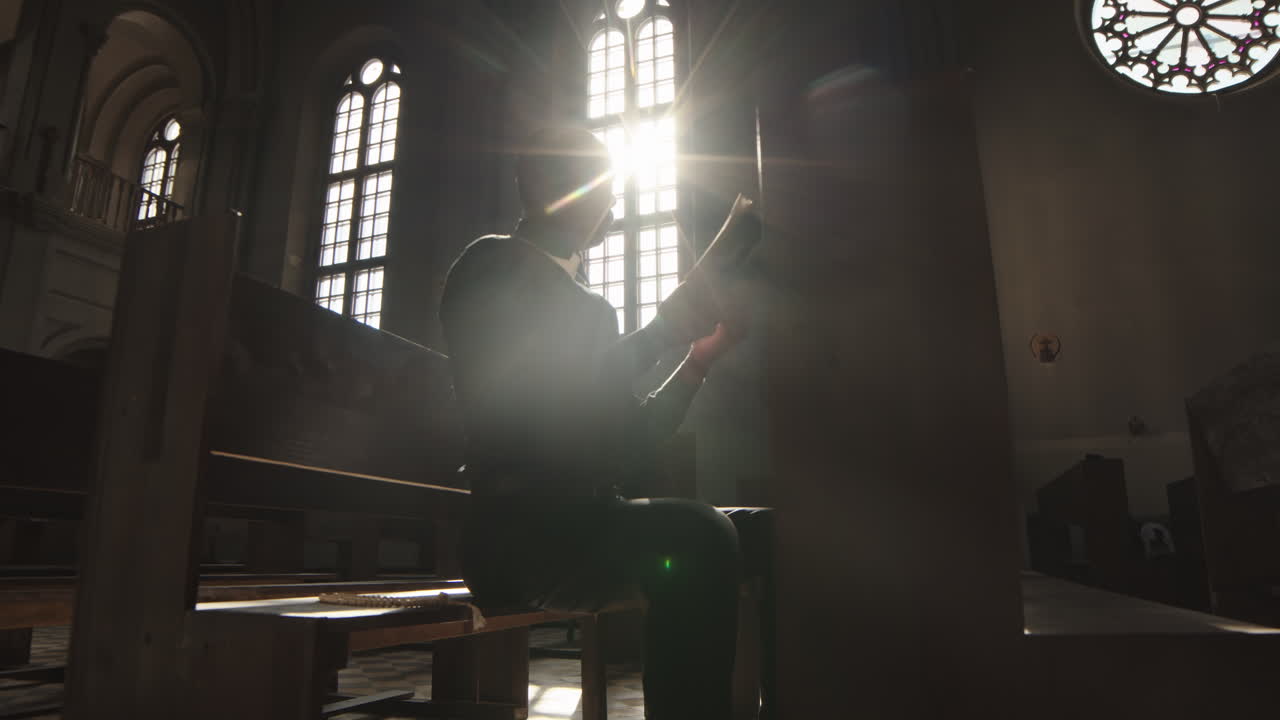 African-American Clergyman Praying in Christian Church