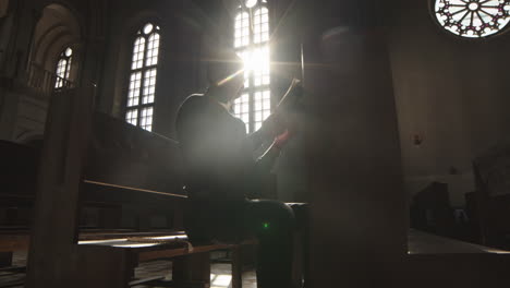 african-american clergyman praying in christian church