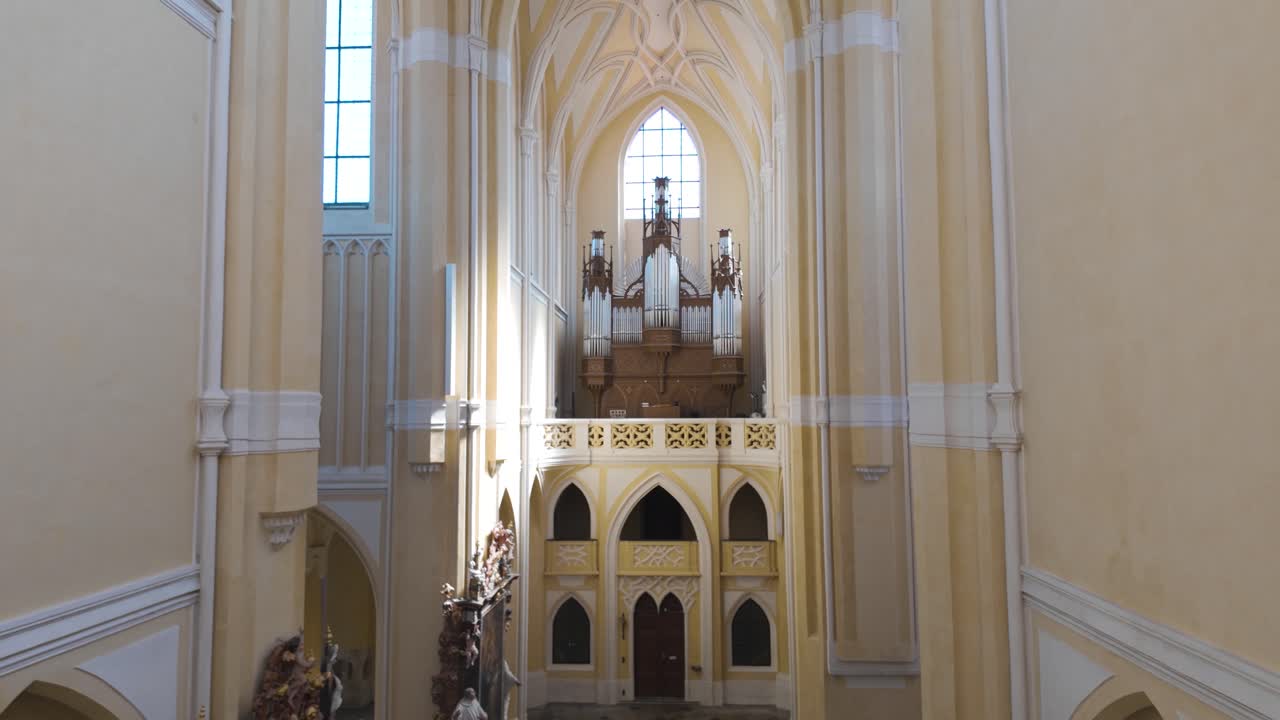 View of the altar inside the Cathedral of Assumption of Our Lady and St. John the Baptist in Kutná Hora, Czech Republic. Tilt up Shot