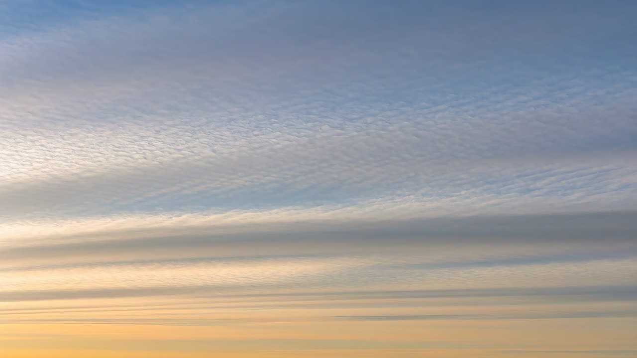 Colorful Sunset or Sunrise Sky with Layered Cloud Formations