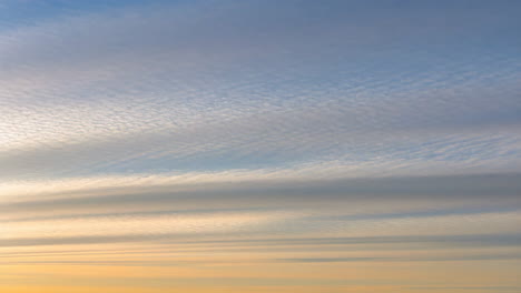colorful sunset or sunrise sky with layered cloud formations