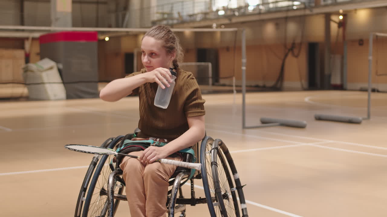 Sportsgirl with Disability Drinking Water
