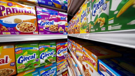 cereal aisle in a supermarket with full shelves