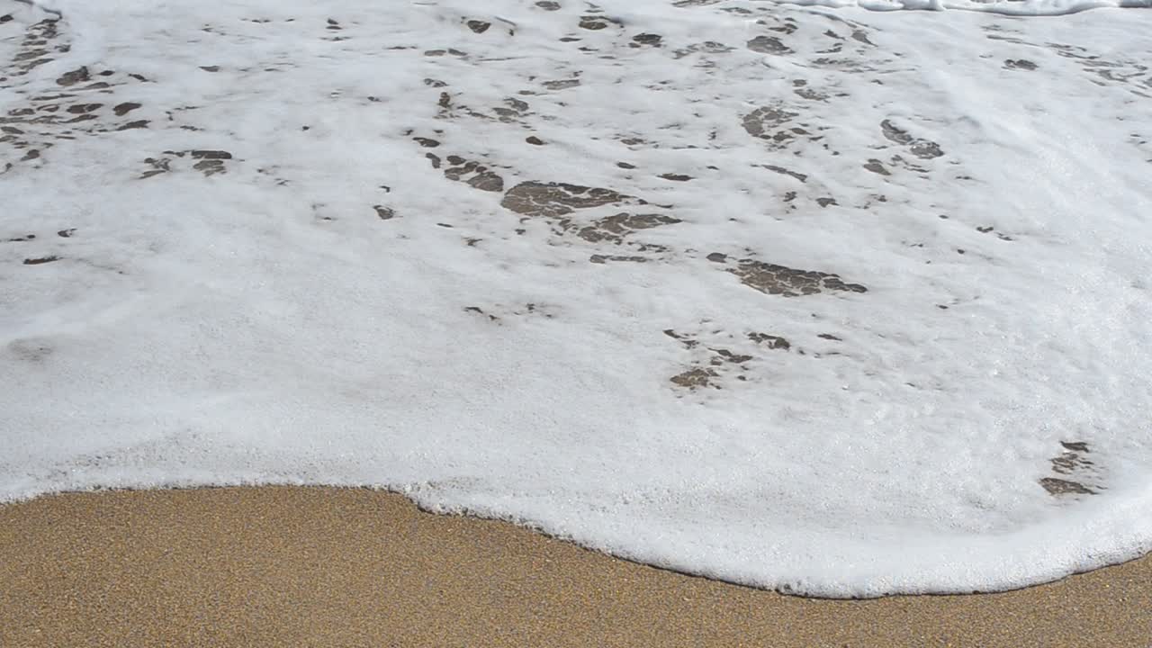 Beach and waves, bright sun. Shooting on the beach