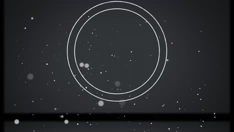 animation of white circles with spots flickering on grey background