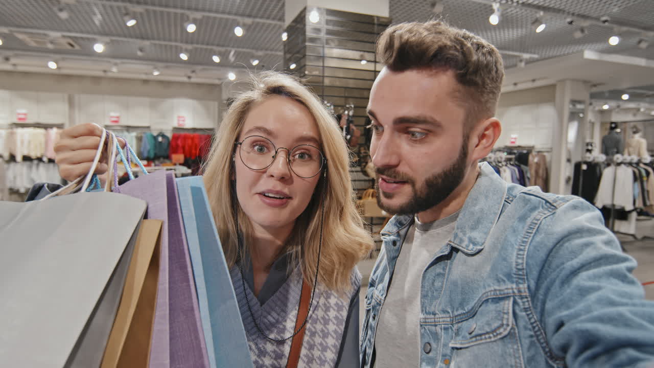 POV Happy Young Couple Video Chatting In Shopping Centre